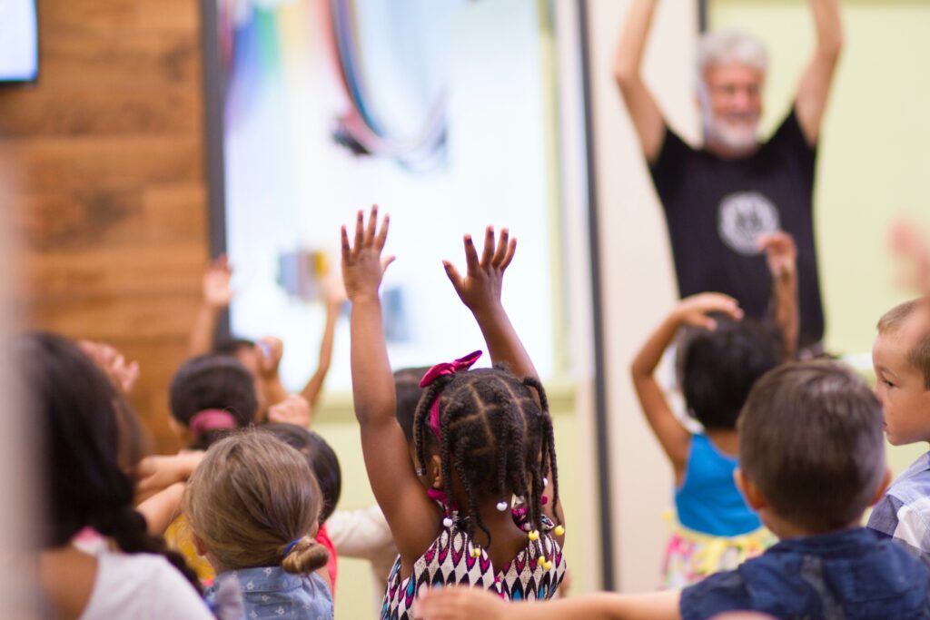 Kids raising their hands